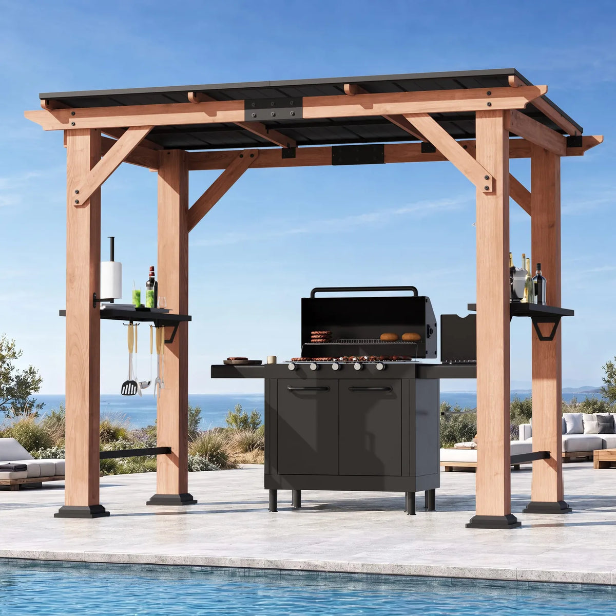 Wooden gazebo with black metal roof sheltering a gas grill beside a pool in bright daylight